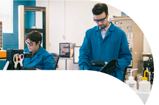 Two people working in a materials lab